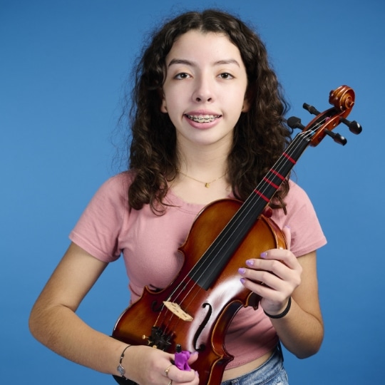 Ashley playing violin at Key to Change