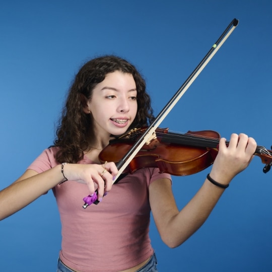 Ashley playing violin at Key to Change