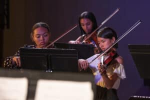 Three students perform